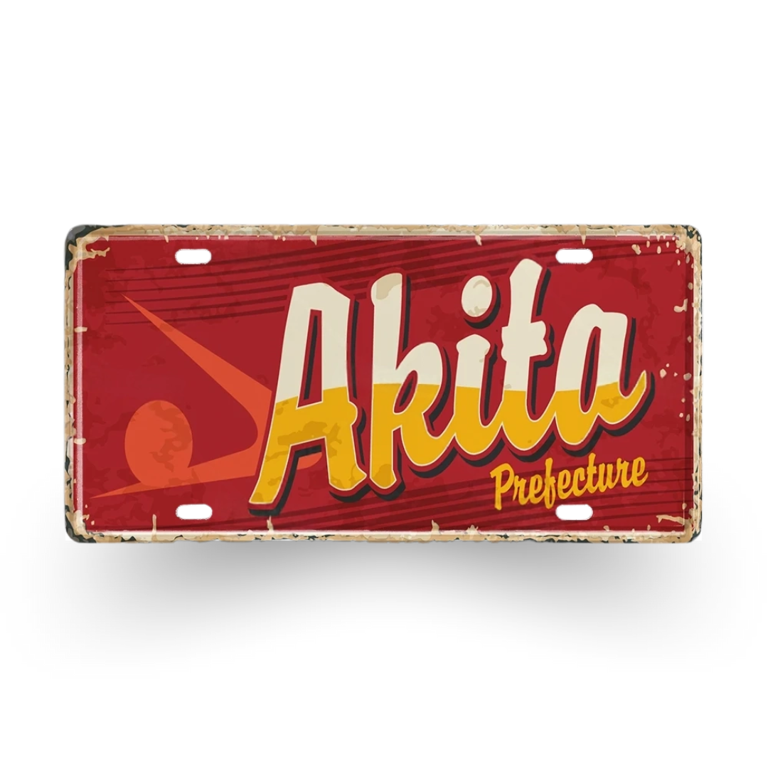 Vintage-style license plate with 'Akita Prefecture' text on a red background