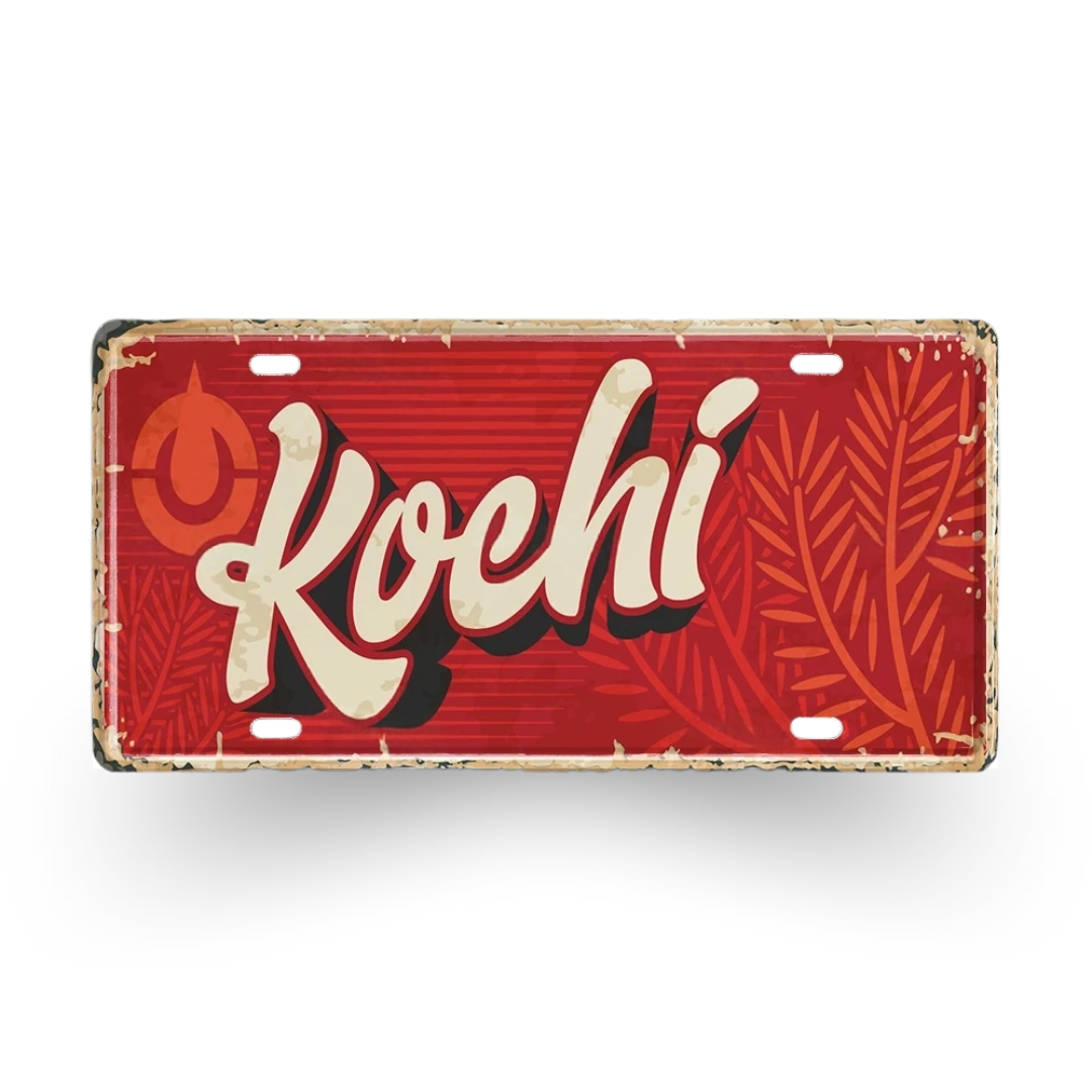 Red license plate with 'Kochi' text and leaf patterns on a white background