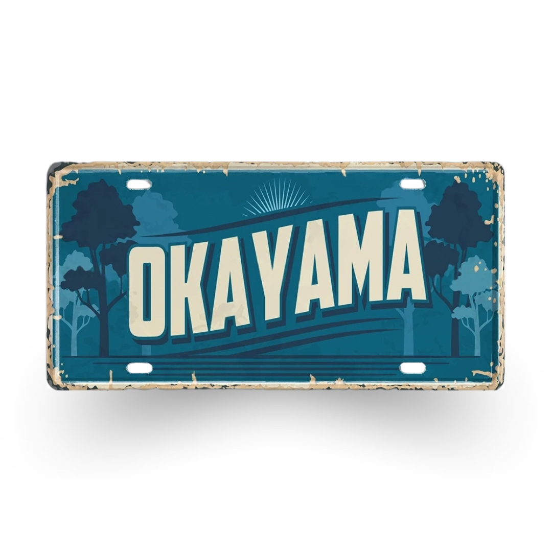 Vintage-style sign with 'Okayama' text on a white background