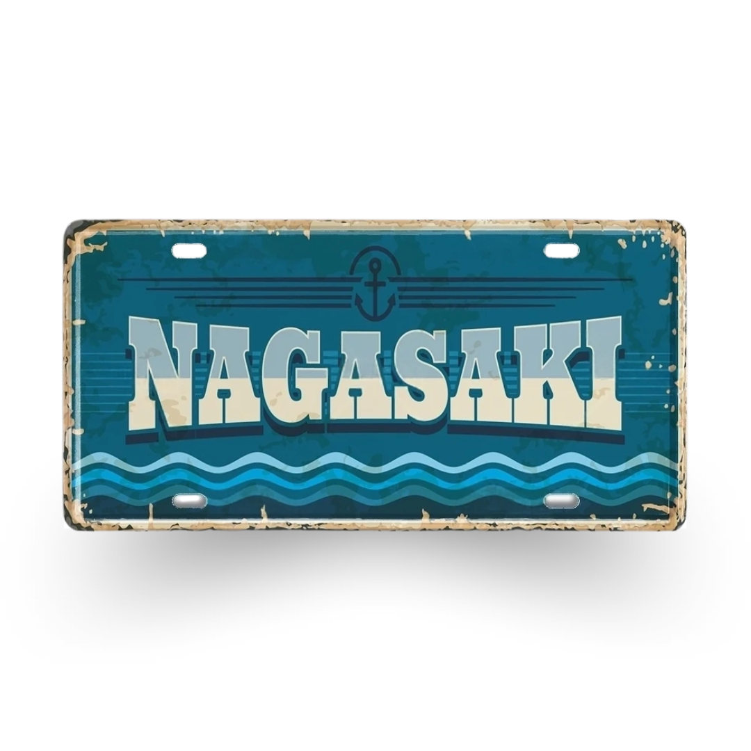 Vintage-style license plate with 'NAGASAKI' text and wave design on a blue background