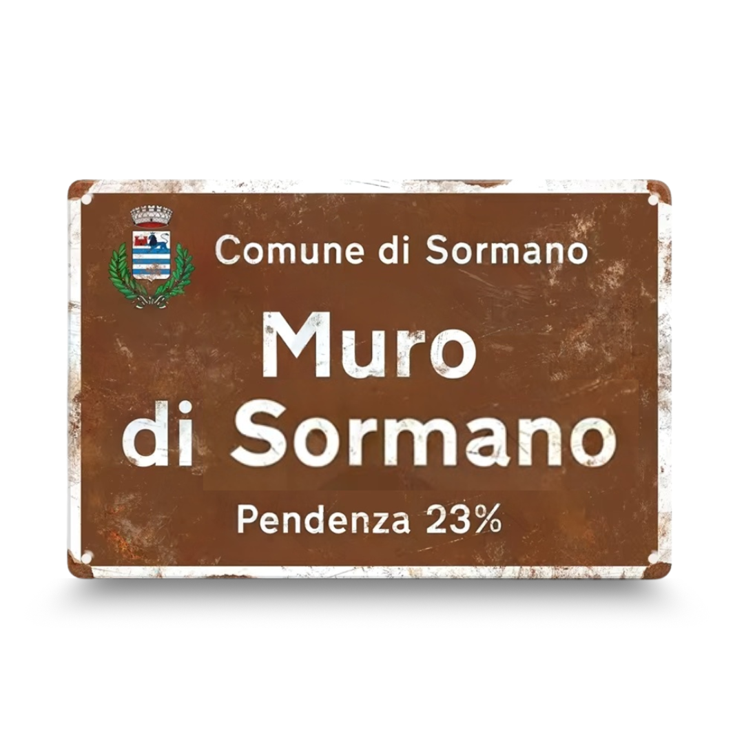 Vintage-style sign with 'Comune di Sormano' and 'Muro di Sormano' text on a brown background.