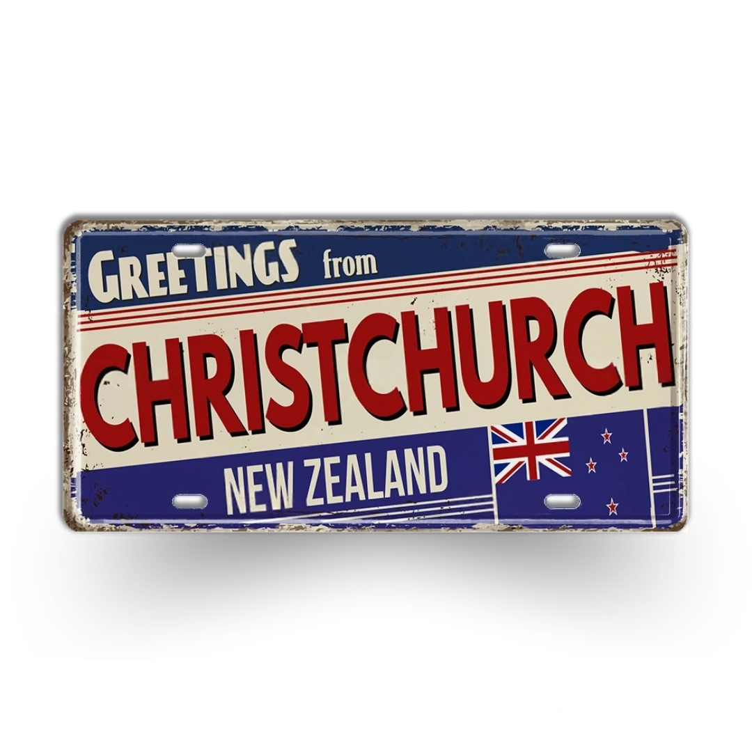 Vintage-style sign with 'Greetings from Christchurch, New Zealand' text and flag design.