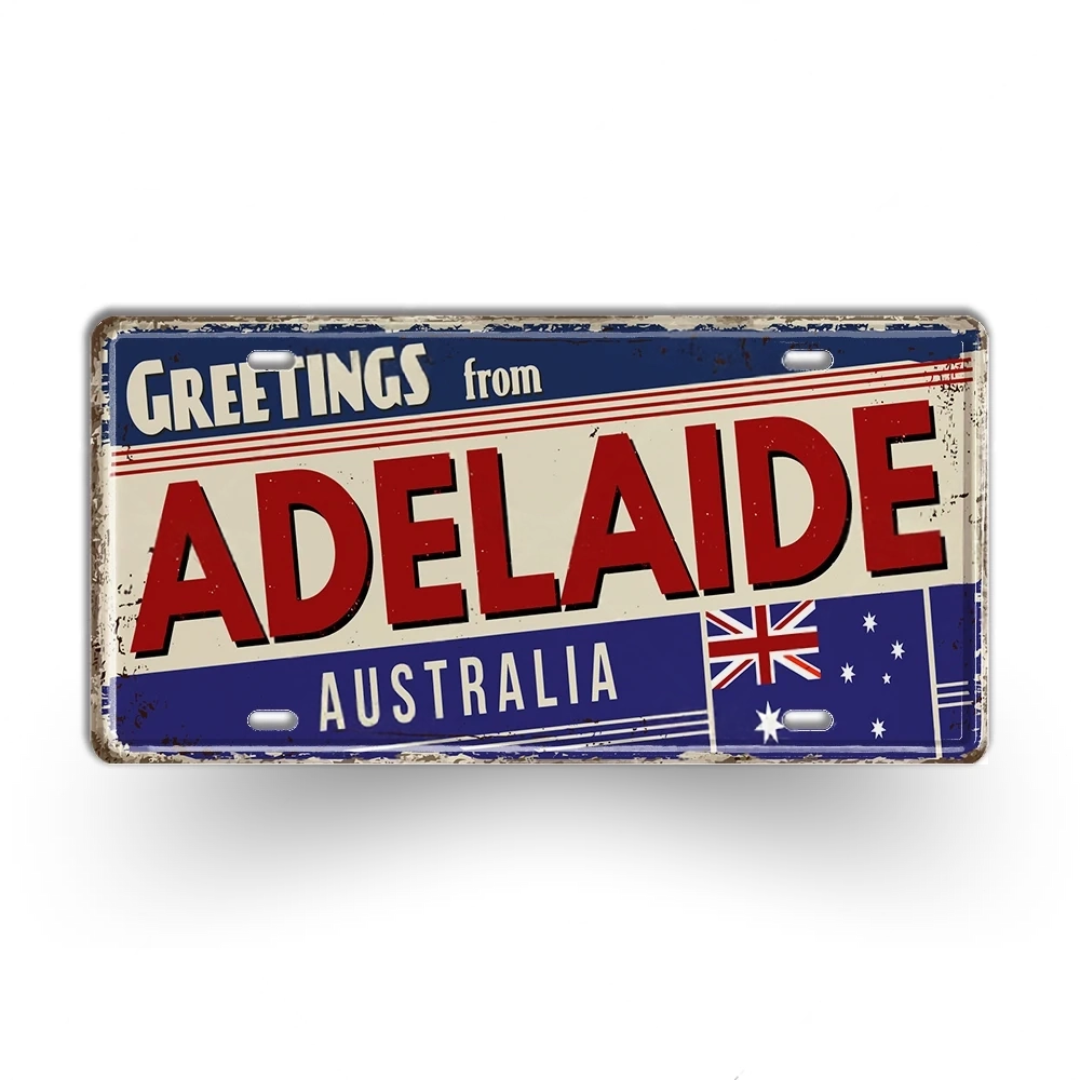 Vintage-style sign with 'Greetings from Adelaide, Australia' text and Australian flag.