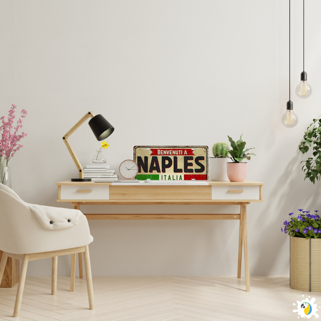 Home office with a desk, chair, lamp, and decorative items including a 'BENVENUTI A NAPLES ITALIA' sign.