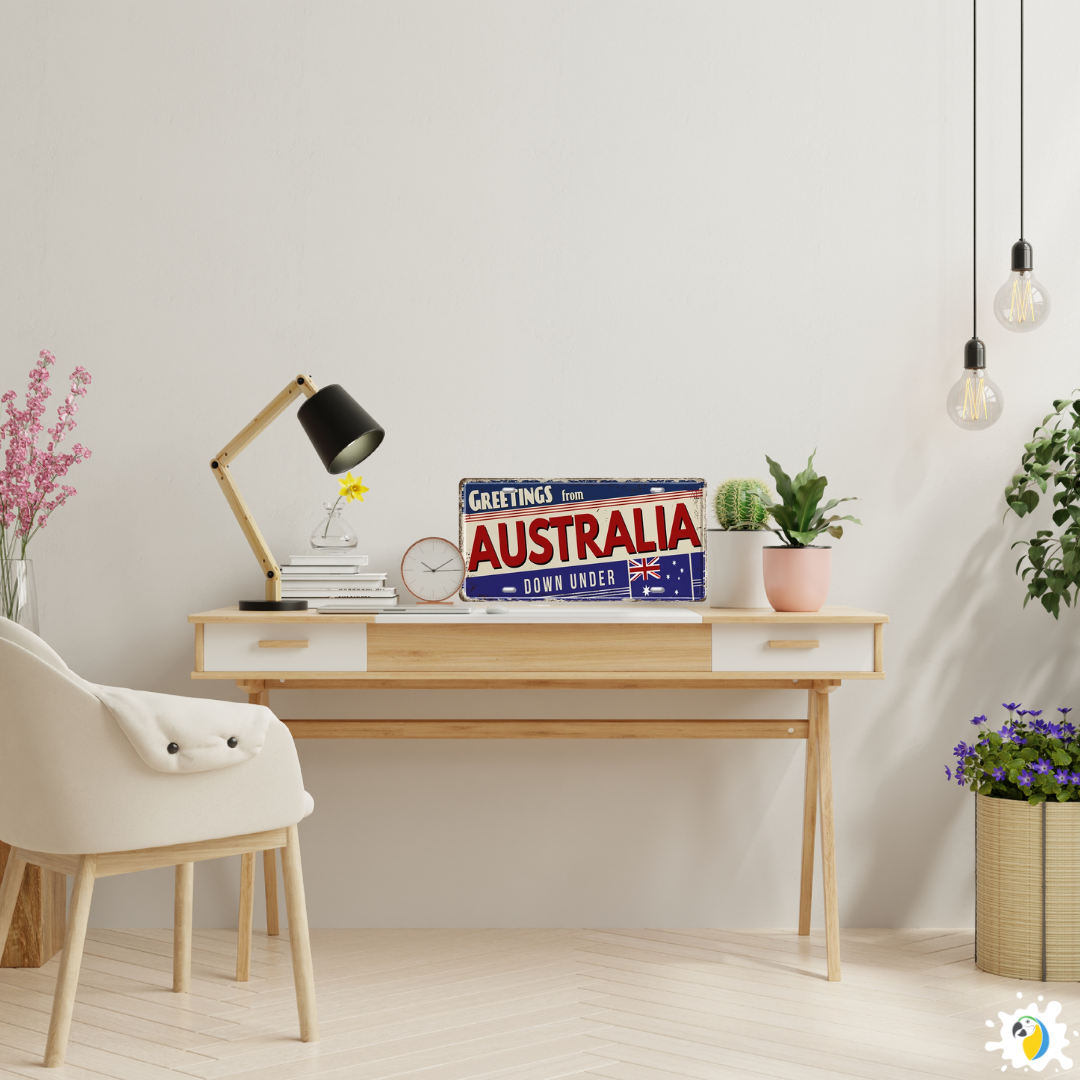 Modern home office with a desk, chair, and decorative items including a 'Greetings from Australia' sign.