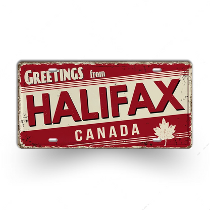 Vintage-style sign with 'Greetings from Halifax, Canada' text on a red and beige background.