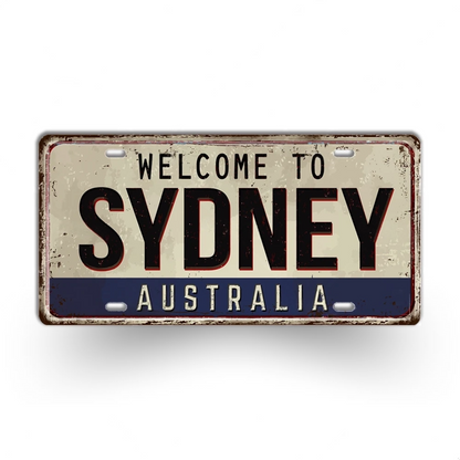 Vintage-style sign with 'Welcome to Sydney Australia' text on a white background