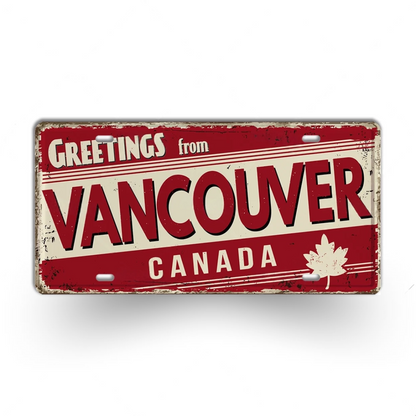 Vintage-style sign with 'Greetings from Vancouver Canada' text and a maple leaf on a white background