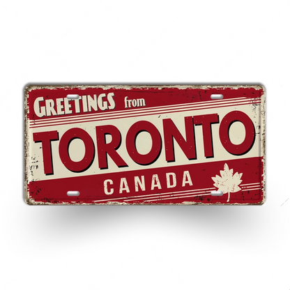 Vintage-style sign with 'Greetings from Toronto, Canada' text and a maple leaf on a white background