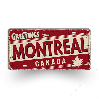 Vintage-style sign with 'Greetings from Montreal, Canada' text and a maple leaf on a white background.