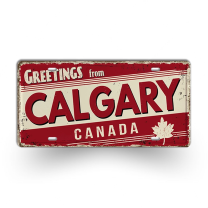 Vintage-style sign with 'Greetings from Calgary, Canada' text and a maple leaf on a white background.