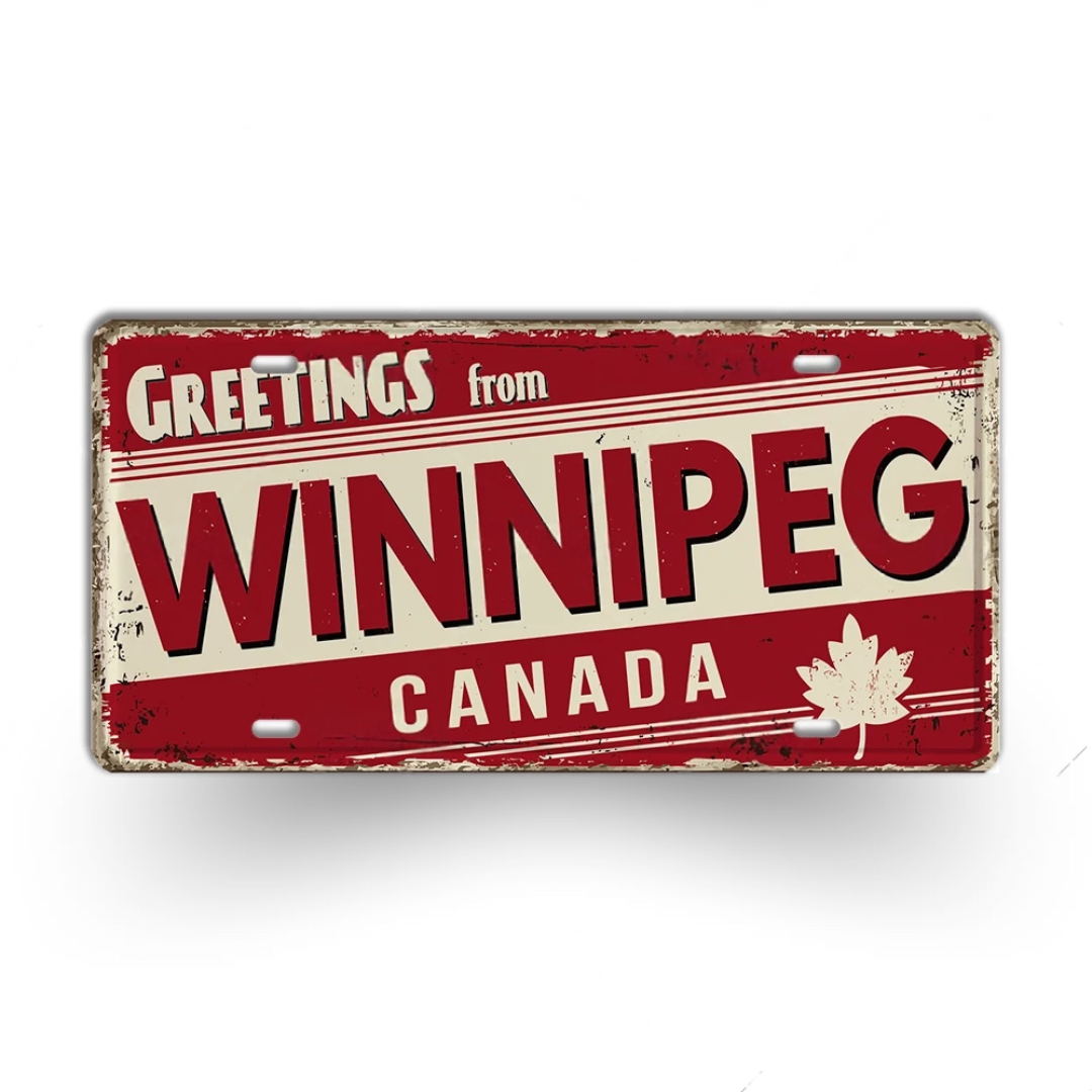 Vintage-style sign with 'Greetings from Winnipeg Canada' text and a maple leaf on a white background