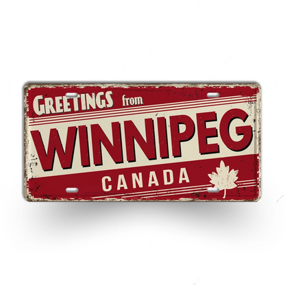 Vintage-style sign with 'Greetings from Winnipeg Canada' text and a maple leaf on a white background