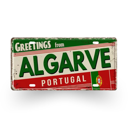 Vintage-style sign with 'Greetings from Algarve Portugal' text on a white background