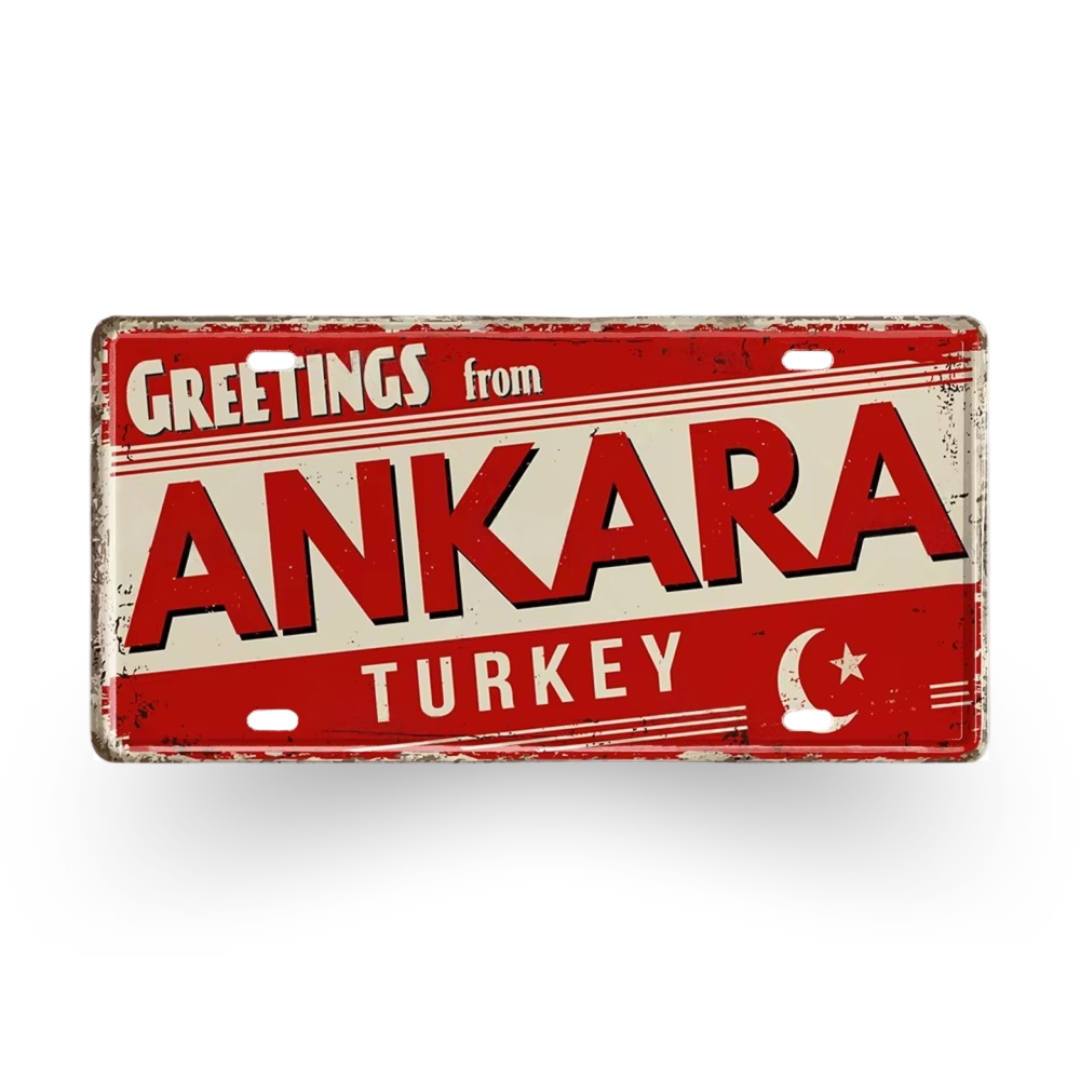 Vintage-style sign with 'Greetings from Ankara, Turkey' text on a red background