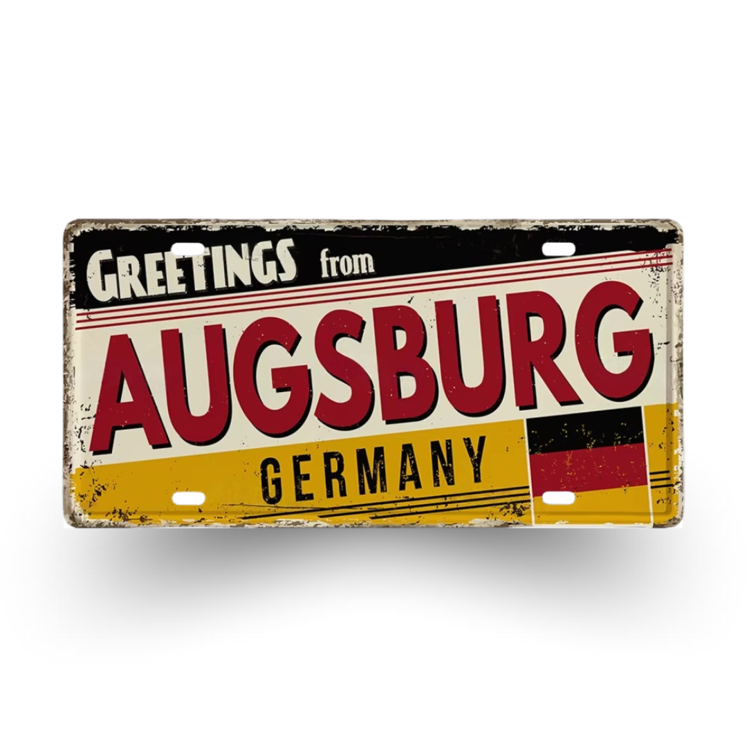 Vintage-style sign with 'Greetings from Augsburg, Germany' text on a white background