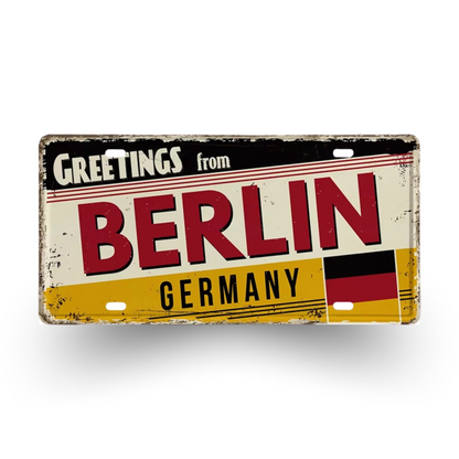Vintage-style sign with 'Greetings from Berlin, Germany' text and German flag design.