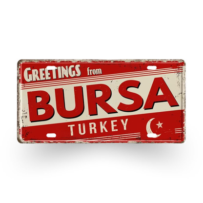 Vintage-style sign with 'Greetings from Bursa Turkey' text on a red background