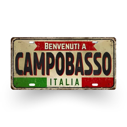 Vintage-style sign with 'Benvenuti a Campobasso Italia' text on a white background