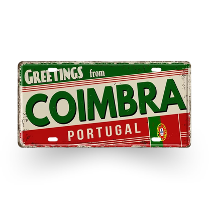 Vintage-style sign with 'Greetings from Coimbra, Portugal' text on a white background