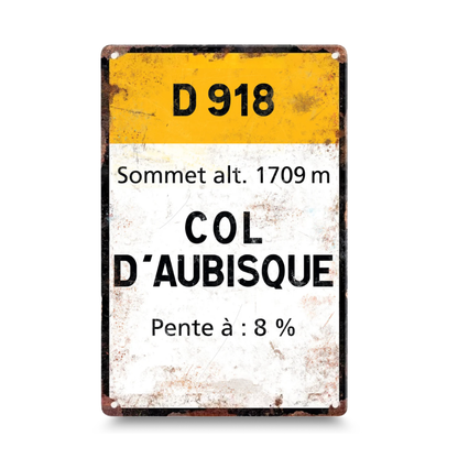 Vintage-style metal sign with road information for Col d'Aubisque on a white background