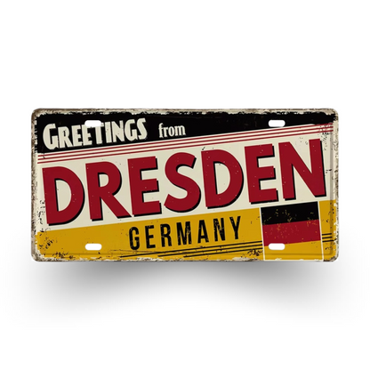 Vintage-style sign with 'Greetings from Dresden, Germany' text and German flag design.