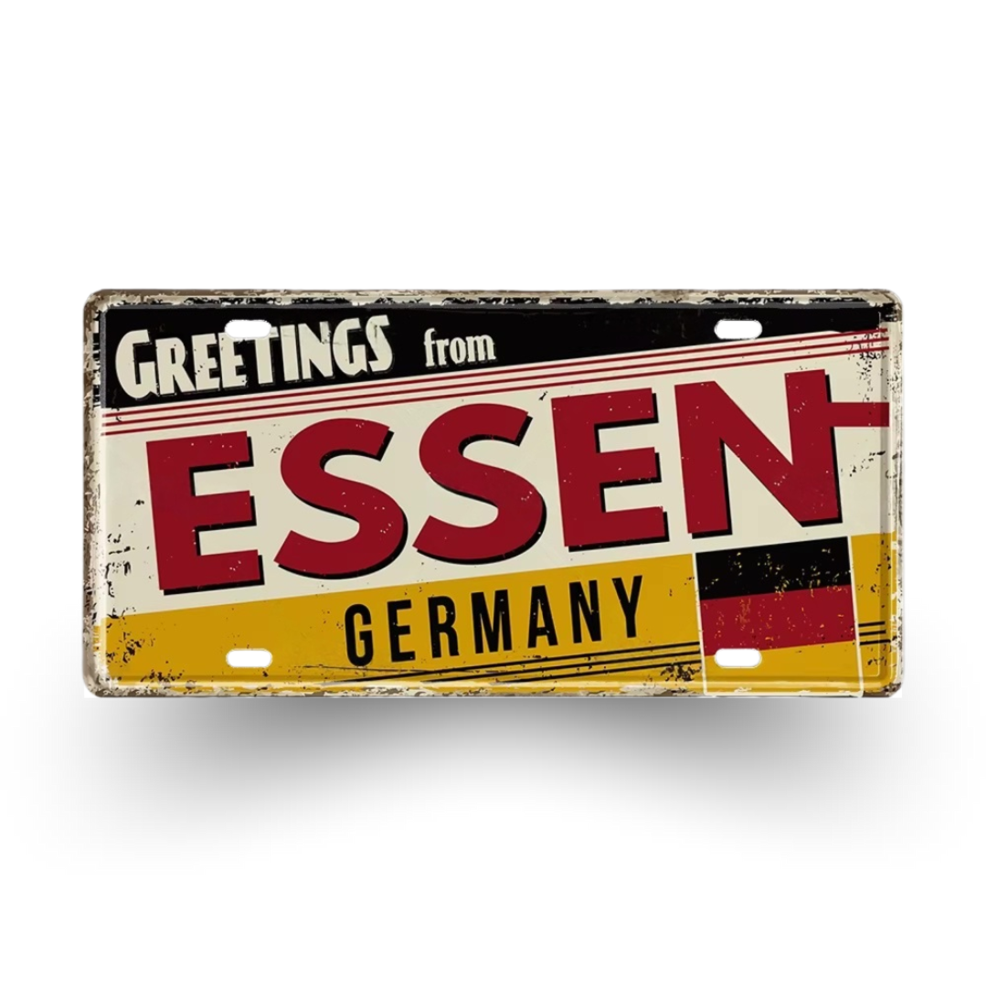 Vintage-style sign with 'Greetings from Essen, Germany' text on a white background