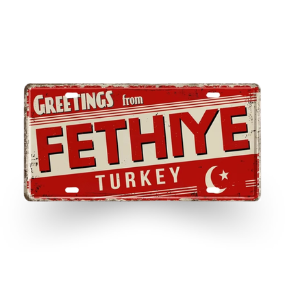 Vintage-style sign with 'Greetings from Fethiye Turkey' text on a red background