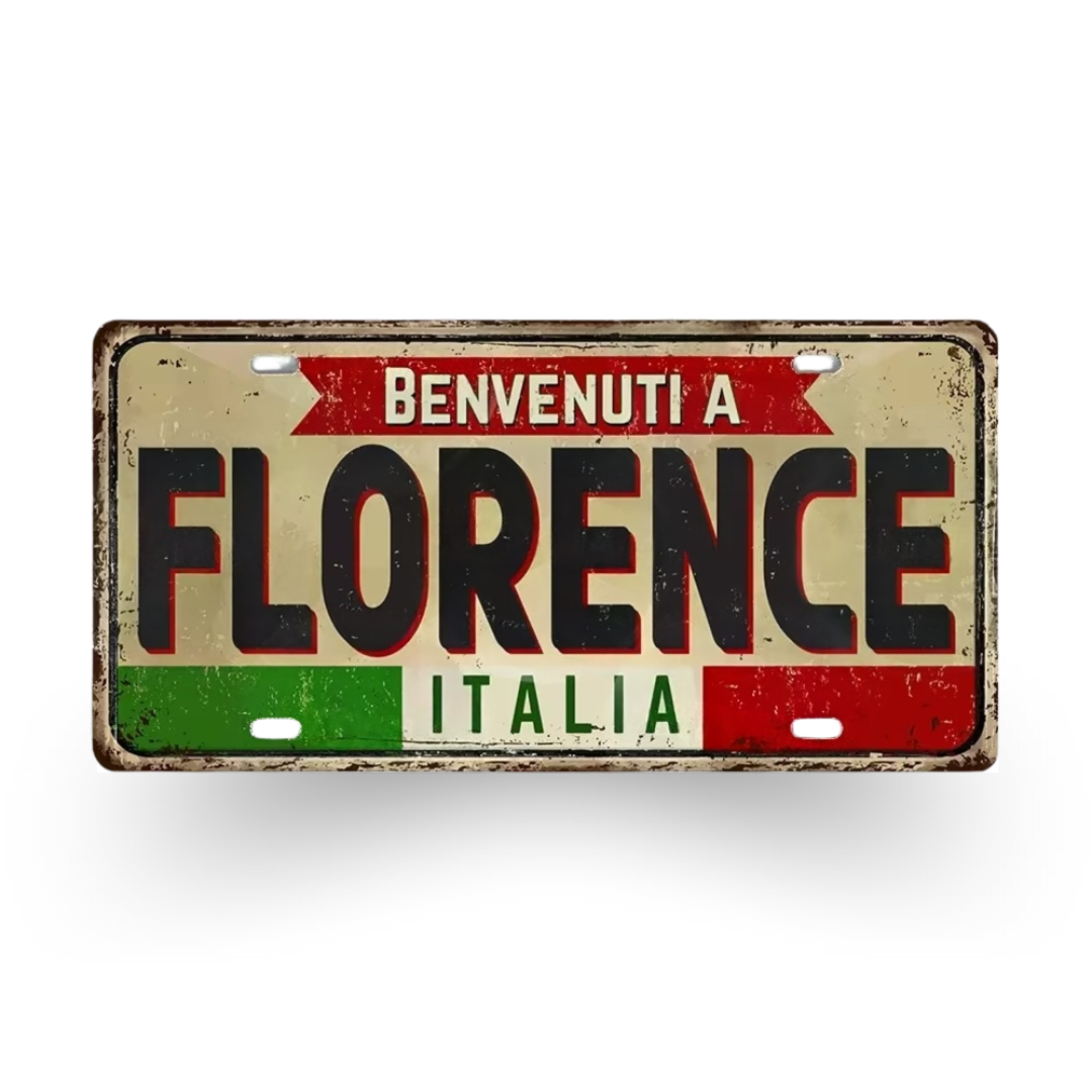 Decorative sign with 'Benvenuti a Florence Italia' text on a white background