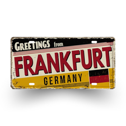 Vintage-style sign with 'Greetings from Frankfurt, Germany' text and German flag design.