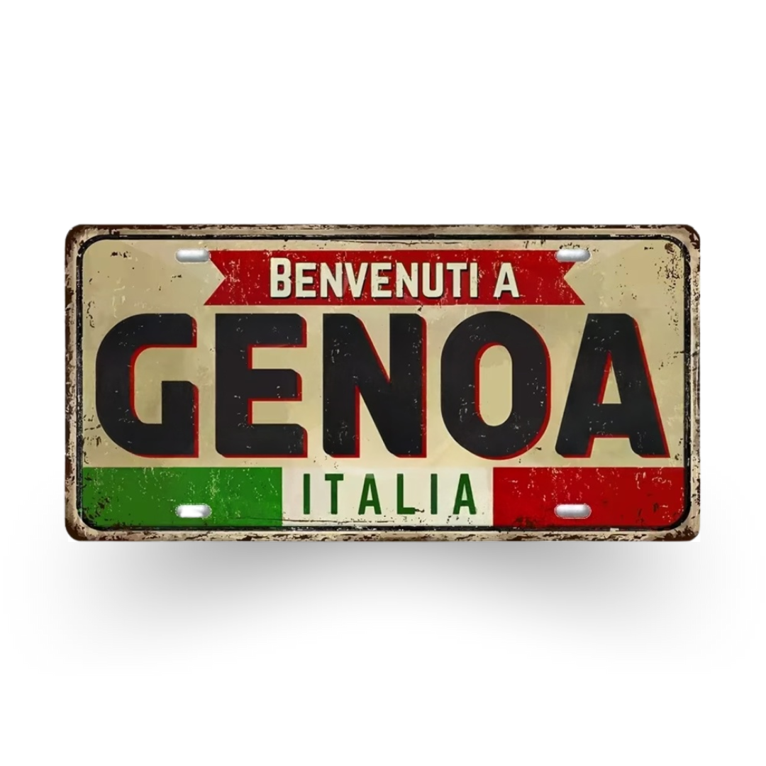 Decorative sign with 'Benvenuti a Genoa Italia' text on a white background