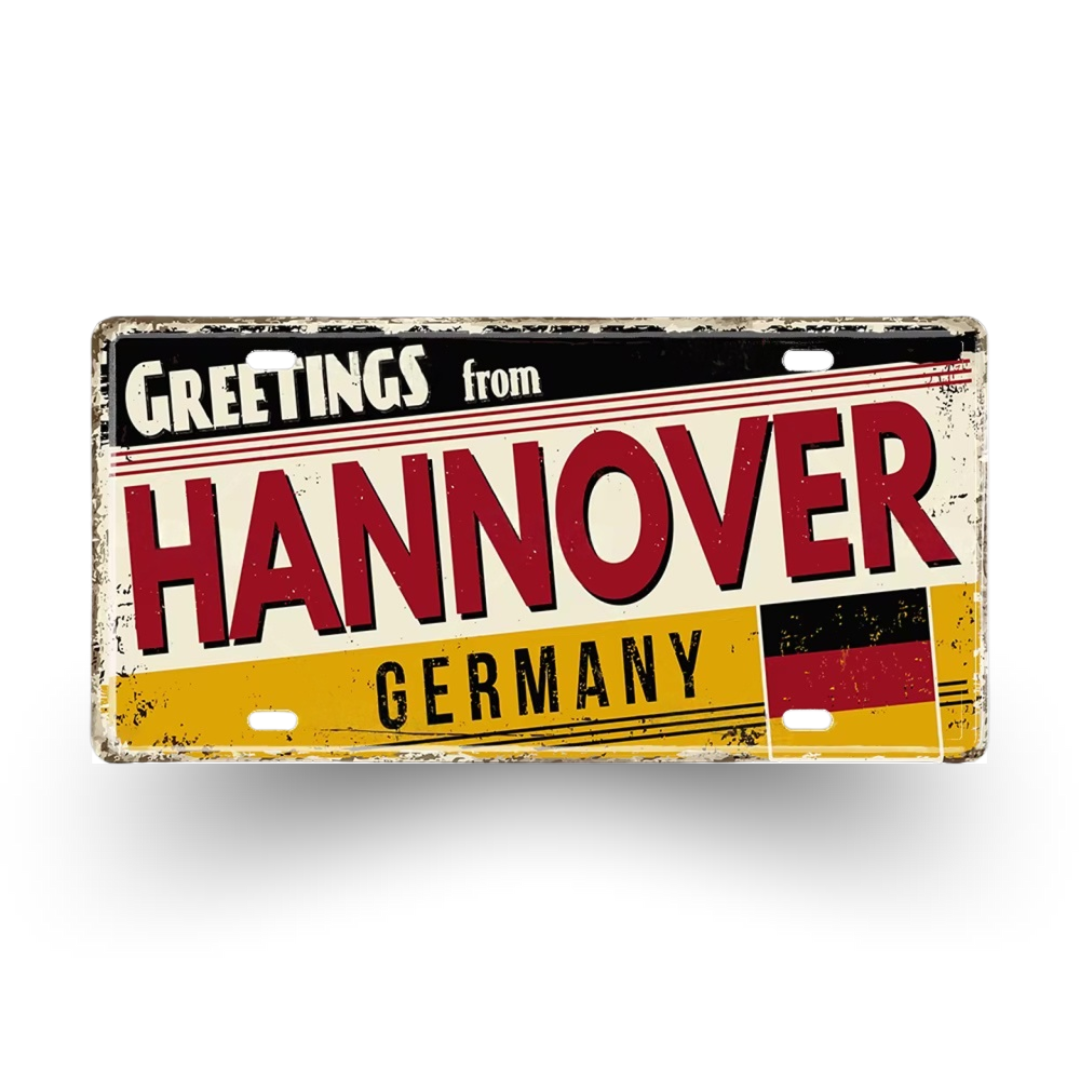 Vintage-style sign with 'Greetings from Hannover, Germany' text and German flag design.