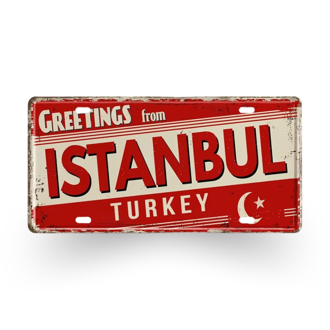 Vintage-style sign with 'Greetings from Istanbul, Turkey' text on a red and beige background.