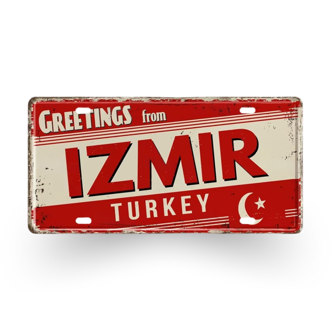 Vintage-style sign with 'Greetings from Izmir Turkey' text on a red background