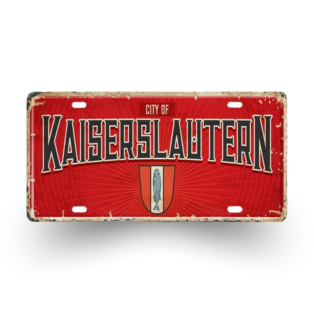 Red license plate with 'City of Kaiserslautern' text and emblem on a white background