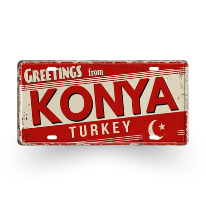 Vintage-style sign with 'Greetings from Konya Turkey' text on a red background