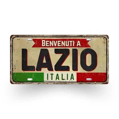 Decorative sign with 'Benvenuti a Lazio Italia' text on a white background