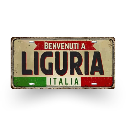 Decorative sign with 'Benvenuti a Liguria Italia' text on a white background