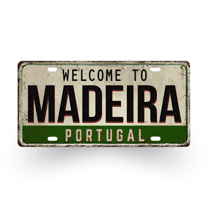 Vintage-style sign with 'Welcome to Madeira Portugal' text on a white background