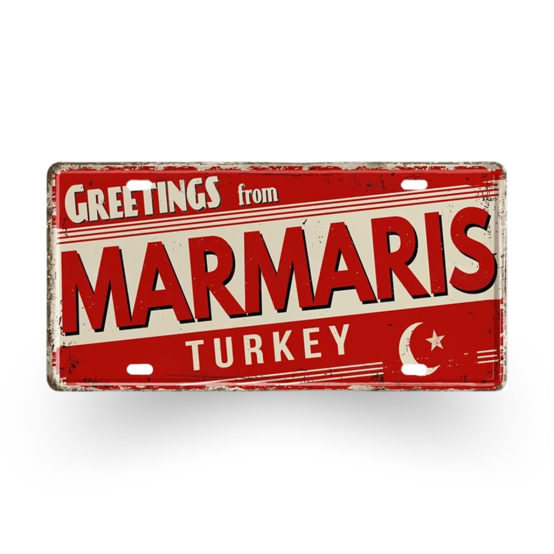 Vintage-style sign with 'Greetings from Marmaris, Turkey' text on a red and beige background.