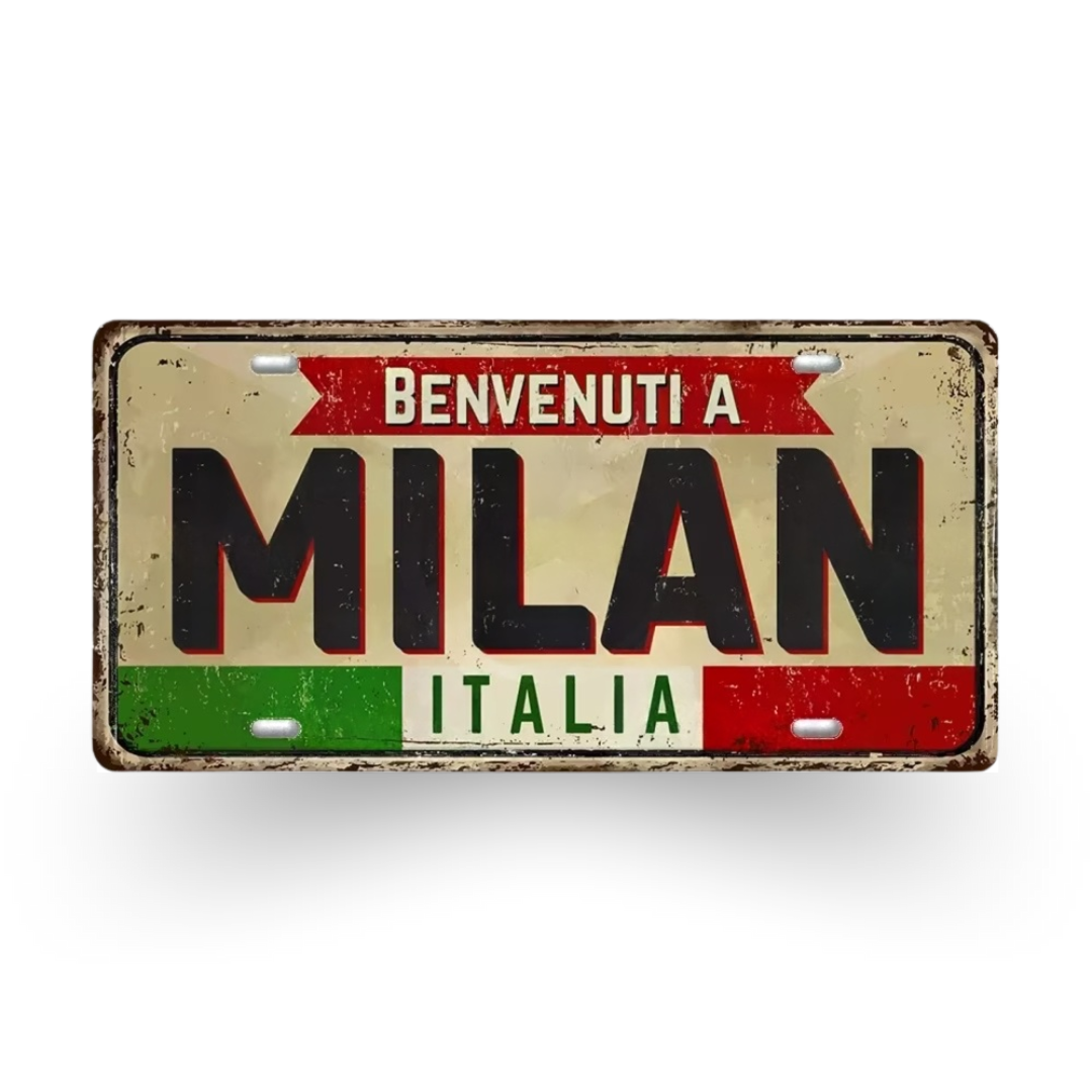Decorative license plate with 'Benvenuti a Milan Italia' text on a white background