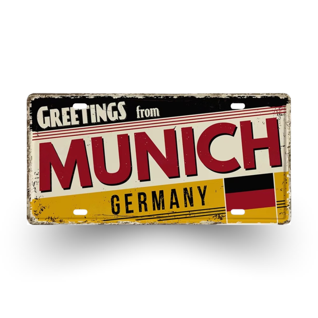 Vintage-style sign with 'Greetings from Munich, Germany' text and German flag on a white background