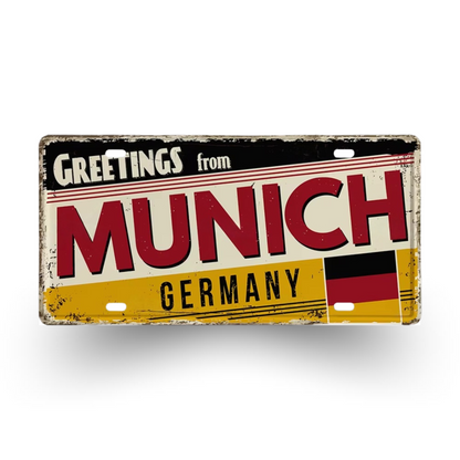 Vintage-style sign with 'Greetings from Munich, Germany' text and German flag on a white background