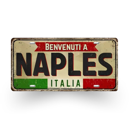 Decorative sign with 'Benvenuti a Naples Italia' text on a white background