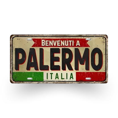 Decorative sign with 'Benvenuti a Palermo Italia' text on a white background