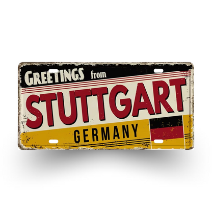 Vintage-style sign with 'Greetings from Stuttgart, Germany' text and German flag design.