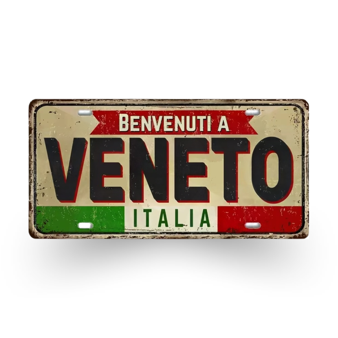 Decorative sign with 'Benvenuti a Veneto Italia' text on a white background
