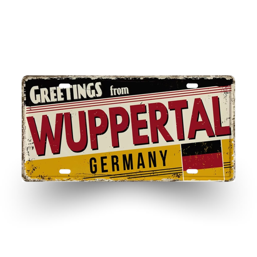 Vintage-style sign with 'Greetings from Wuppertal, Germany' text on a white background
