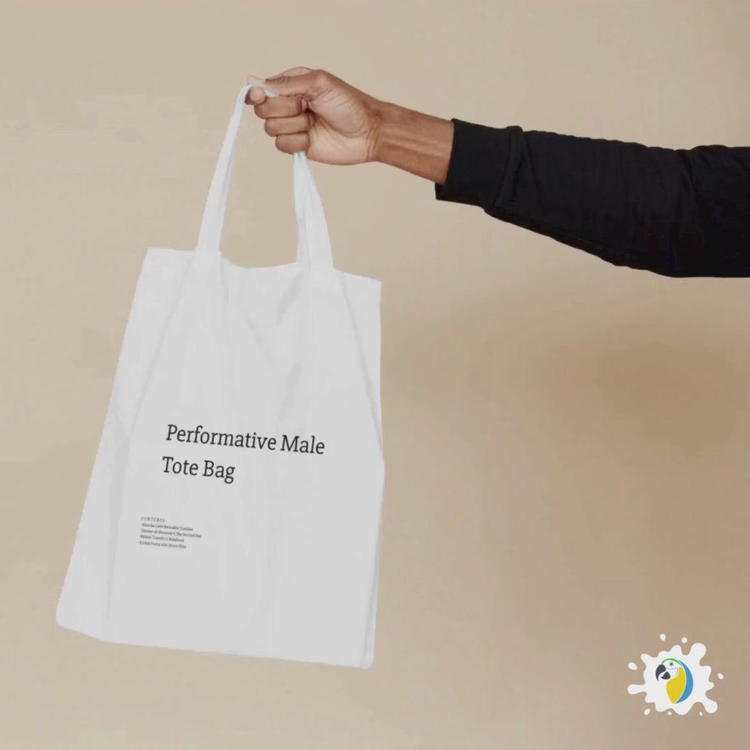 A stylish canvas tote bag featuring a self-aware aesthetic, designed for the modern male shopper. The bag showcases a unique performative design, blending functionality with contemporary art influences, perfect for carrying everyday essentials.