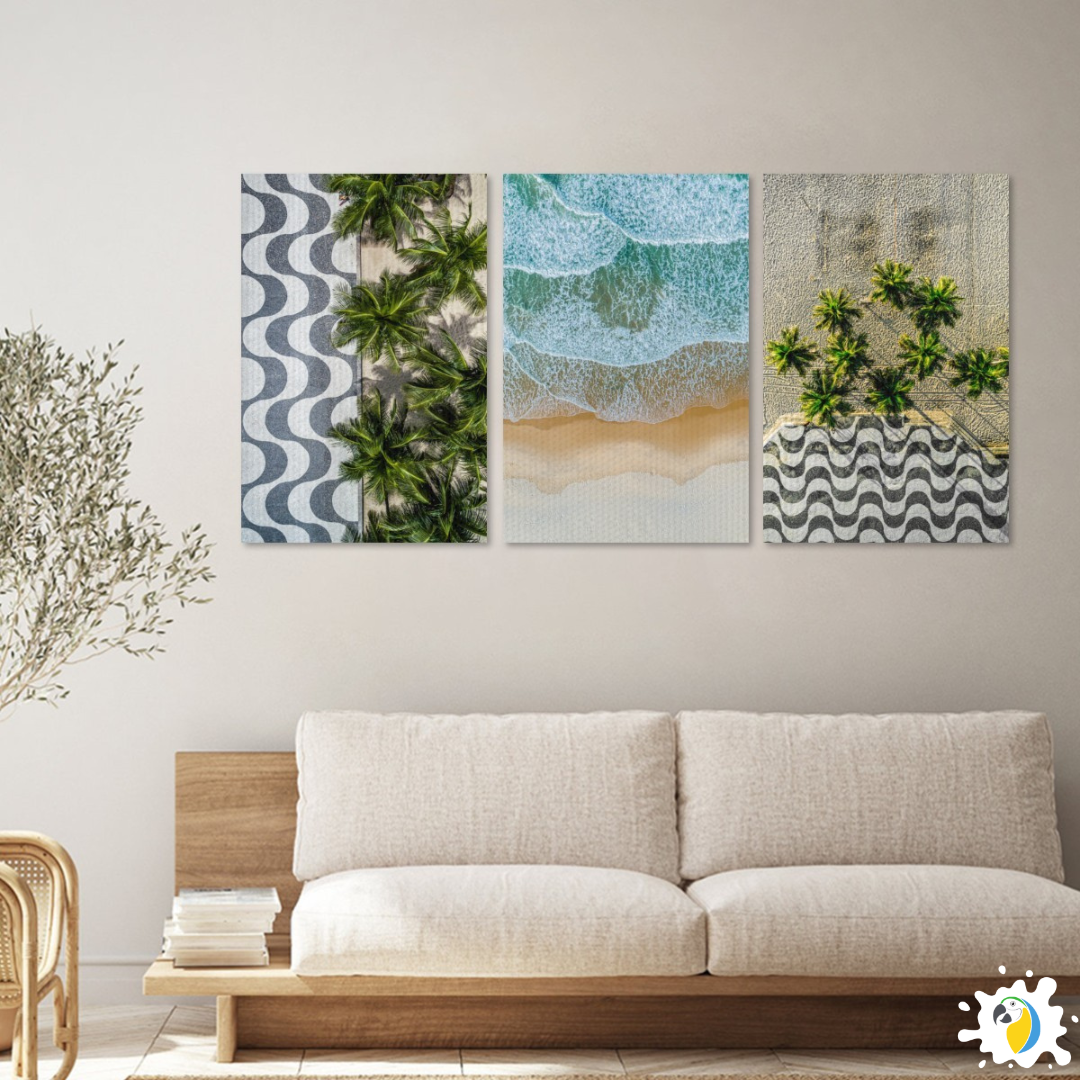 A trio of framed pieces depicting Copacabana Beach in Rio de Janeiro, Brazil hangs on the wall above an understatedly hued sofa.